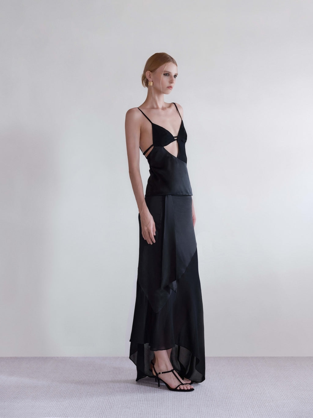 Väme Black Halo Satin Paneled Top with asymmetric satin viscose cut-out design.